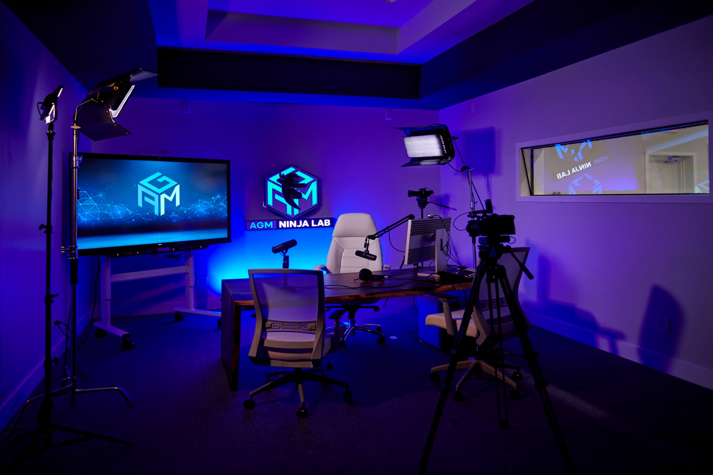 The AGM Ninja Lab production studio lit in purple